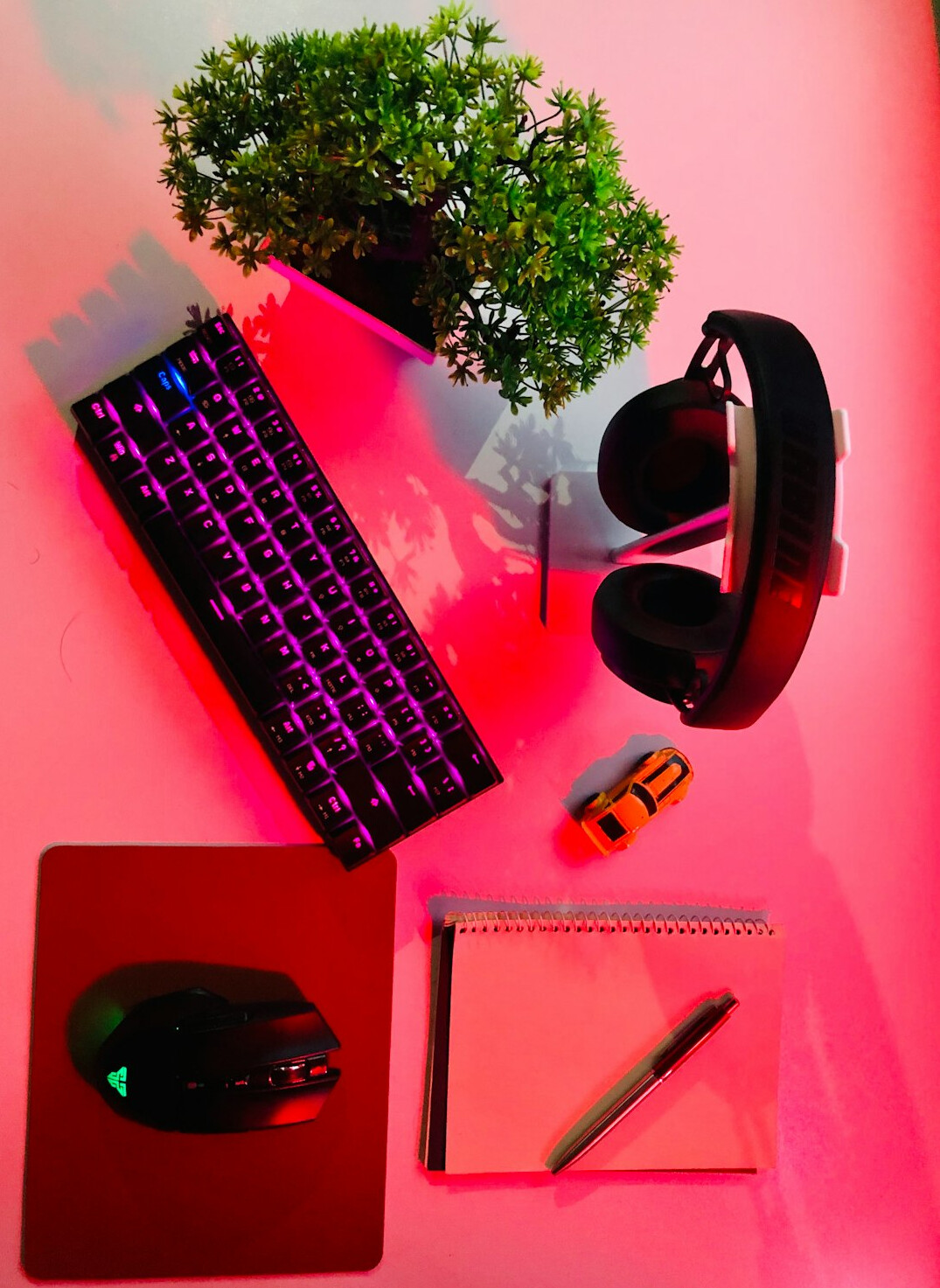 Laptop with video lesson, headphones and notebook on a desk