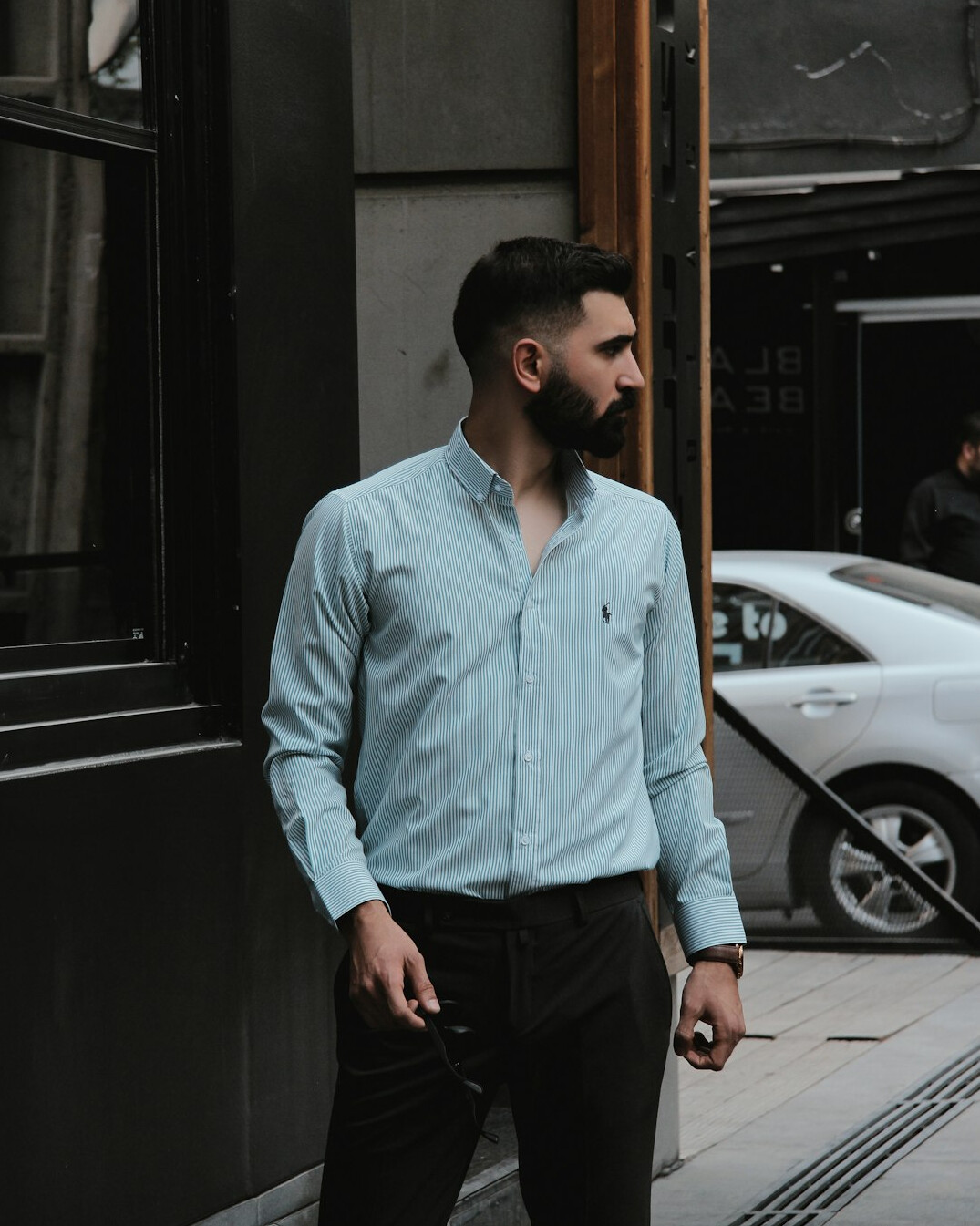 Portrait of a man with a beard in a business casual shirt